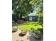 Spacious backyard with a deck, seating, and well-manicured lawn, ideal for outdoor activities at 4455 Wolff St, Denver, CO 80212
