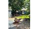Relaxing backyard setting with a charming deck, fire pit, and well-maintained lawn at 4455 Wolff St, Denver, CO 80212