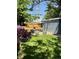 Lush backyard with a fire pit, wooden fence, and charming planters, creating a serene outdoor space at 4455 Wolff St, Denver, CO 80212