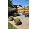 Private backyard patio featuring comfortable seating, a fire pit, and well-maintained landscaping at 4455 Wolff St, Denver, CO 80212