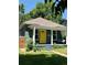 Charming single-story home with a bright yellow front door and inviting front porch at 4455 Wolff St, Denver, CO 80212