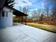 Expansive backyard with a concrete patio and a covered porch, perfect for outdoor entertaining at 1853 S Urban Way, Lakewood, CO 80228