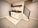 Finished basement with a modern bar area, perfect for entertaining, featuring sleek countertops and ample storage at 1853 S Urban Way, Lakewood, CO 80228