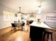 Modern kitchen featuring stainless steel appliances, a stylish backsplash, island and hardwood floors at 1853 S Urban Way, Lakewood, CO 80228