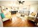 Inviting open-concept living space featuring wood floors, modern furnishings, and natural light at 1853 S Urban Way, Lakewood, CO 80228