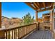 Balcony with neighborhood views framed by wooden railings and a pergola, offering a cozy outdoor retreat at 5574 W 72Nd Dr, Arvada, CO 80003