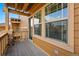 Balcony view with wood accents and a glimpse of the community, creating a cozy outdoor living space at 5574 W 72Nd Dr, Arvada, CO 80003