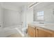 Bathroom with tub-shower combo, tile floor, and vanity at 5574 W 72Nd Dr, Arvada, CO 80003