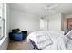 Bright primary bedroom with a ceiling fan and view of neighborhood at 5574 W 72Nd Dr, Arvada, CO 80003