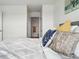 Close up view of bright primary bedroom with pillows at 5574 W 72Nd Dr, Arvada, CO 80003