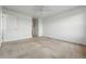 Neutral carpet, white walls and ceiling, and white painted door and trim at 5574 W 72Nd Dr, Arvada, CO 80003