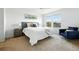 Bright primary bedroom with a ceiling fan and view of neighborhood at 5574 W 72Nd Dr, Arvada, CO 80003