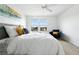 Bright primary bedroom with a ceiling fan and view of neighborhood at 5574 W 72Nd Dr, Arvada, CO 80003