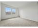Bright bedroom with neutral carpet and a double window at 5574 W 72Nd Dr, Arvada, CO 80003