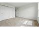 Bedroom with carpet, a large double door closet, and a window at 5574 W 72Nd Dr, Arvada, CO 80003