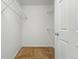 Walk-in closet with metal shelving and neutral carpet at 5574 W 72Nd Dr, Arvada, CO 80003