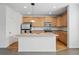 Bright kitchen featuring stainless steel appliances, an island with a sink, and plenty of cabinet space at 5574 W 72Nd Dr, Arvada, CO 80003