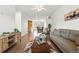 Open floor plan with hardwood floors, and seamlessly connected to a dining area and kitchen for modern living at 5574 W 72Nd Dr, Arvada, CO 80003