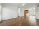 Bright living room with open access to the kitchen and dining area and wood flooring at 5574 W 72Nd Dr, Arvada, CO 80003