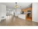 Open-concept living area showcases the kitchen and living room, allowing for easy transition and interaction at 5574 W 72Nd Dr, Arvada, CO 80003