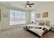 Bright bedroom with carpet, large windows, and stylish decor with comfortable bed and ample natural light at 9283 Twenty Mile Rd # 308, Parker, CO 80134