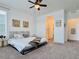 Spacious bedroom with neutral tones, large windows, stylish decor, and carpet with ensuite bathroom at 9283 Twenty Mile Rd # 308, Parker, CO 80134