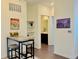 Dining area next to kitchen features modern table set and decor with an adjacent bathroom at 9283 Twenty Mile Rd # 308, Parker, CO 80134