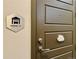 Entry door with a modern design and clear signage for garage access and entry at 9283 Twenty Mile Rd # 308, Parker, CO 80134