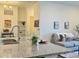 Bright kitchen island with granite countertop, view of living area with sofa and stylish decor at 9283 Twenty Mile Rd # 308, Parker, CO 80134