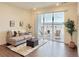Cozy living room with modern decor, sliding glass doors to balcony with outdoor seating and views at 9283 Twenty Mile Rd # 308, Parker, CO 80134