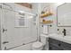 Bathroom with subway tile shower, modern vanity and sink and a framed mirror at 1031 S Pennsylvania St, Denver, CO 80209