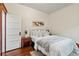Cozy bedroom with hardwood floors, stylish decor, and ample natural light at 1031 S Pennsylvania St, Denver, CO 80209