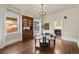 Bright dining room with hardwood floors and view into the kitchen at 1031 S Pennsylvania St, Denver, CO 80209