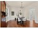 Elegant dining room featuring hardwood floors, stylish chandelier and natural light at 1031 S Pennsylvania St, Denver, CO 80209