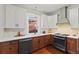 Bright eat-in kitchen features granite countertops, stainless appliances, and hardwood flooring at 1031 S Pennsylvania St, Denver, CO 80209