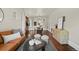 Spacious living room featuring hardwood floors and an open layout to the dining area at 1031 S Pennsylvania St, Denver, CO 80209