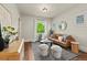 Bright living room with stylish furnishings and a view to the outdoors at 1031 S Pennsylvania St, Denver, CO 80209