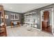 Well-lit office space with shelving, ceramic tile flooring, and modern décor at 1031 S Pennsylvania St, Denver, CO 80209