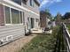 View of the home's backyard patio with outdoor seating and well-maintained landscaping at 14944 E Archer Cir, Aurora, CO 80012