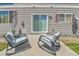 Patio with seating and sliding door accessing a charming backyard at 14944 E Archer Cir, Aurora, CO 80012