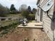 Backyard featuring a small patio area with chairs, ideal for outdoor relaxation and enjoying the serene surroundings at 14944 E Archer Cir, Aurora, CO 80012