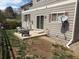 Backyard featuring a small patio area with chairs, ideal for outdoor relaxation and enjoying the serene surroundings at 14944 E Archer Cir, Aurora, CO 80012
