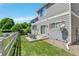 Backyard featuring a white fence and patio with chairs at 14944 E Archer Cir, Aurora, CO 80012