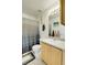 Well-maintained bathroom featuring a shower-tub combination and a stylish vanity with ample lighting and space at 14944 E Archer Cir, Aurora, CO 80012