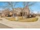 Charming two-story home with a well-manicured lawn, a two-car garage, and mature trees at 14944 E Archer Cir, Aurora, CO 80012