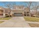 Charming two-story home with a well-maintained front yard, featuring a two-car garage and inviting curb appeal at 14944 E Archer Cir, Aurora, CO 80012