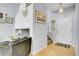 Inviting foyer with hardwood floors, staircase, and neutral color scheme at 14944 E Archer Cir, Aurora, CO 80012