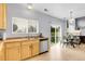 Bright kitchen featuring modern appliances, ample counter space, and an adjacent dining area at 14944 E Archer Cir, Aurora, CO 80012