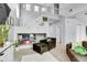 Inviting living room featuring open shelving and staircase, creating a seamless and stylish space at 14944 E Archer Cir, Aurora, CO 80012