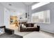 Bright living room showing open floor plan, fireplace, and large window enhancing the space at 14944 E Archer Cir, Aurora, CO 80012